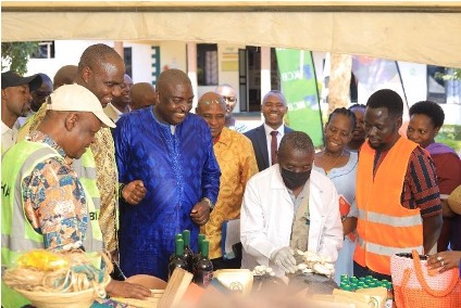 Hon. Henry Musasizi, Minister of Finance, Planning and Economic Development, tours exhibitors at Excel Hort Consult Agribusiness Incubator (EHCAI) alongside Prof. Alex Ariho, AAIN Chief Executive Officer, Prof. Charles Kwesiga, Executive Director of Uganda Industrial Research Institute, Dr. Albert K. Byamugisha, Senior Technical Adviser & Head of the National SDG Secretariat at Office of the Prime Minister (OPM) and other delegates during a high-level engagement on business incubation, innovation and enterprise development