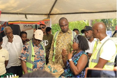 Hon. Henry Musasizi interacts with young entrepreneurs and innovators, witnessing value-added agribusiness products and enterprise solutions nurtured through business incubation.
