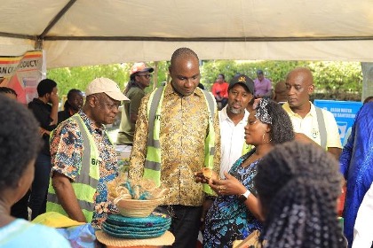 The Minister engages directly with an incubatee from Bishop Stuart University Incubation Hub to better understand the impact of business incubation on entrepreneurship, employment and household incomes